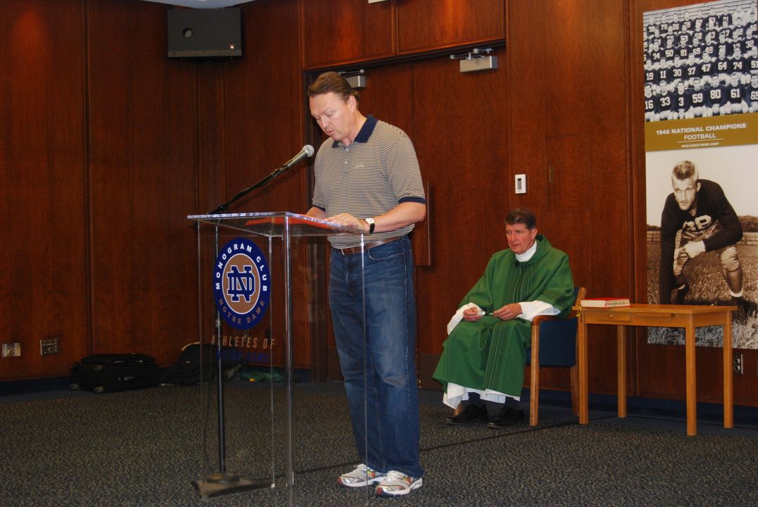 Monogram Club board member Michael Richerson '85 (football) performs a reading at a 2010 post-game Mass.