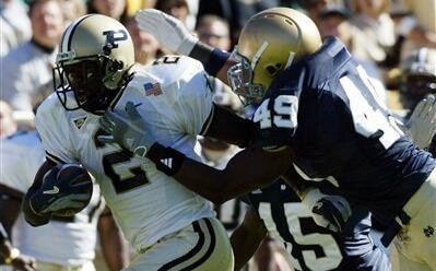Irish Fall To No. 15 Purdue, 41-16 Derek Curry brings down Taylor Stubblefield during the first quarter.