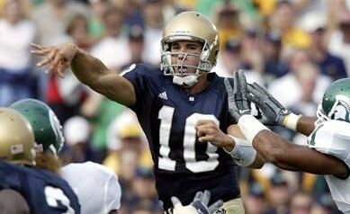 Brady Quinn throws for a school-record five touchdowns and a career-high 487 yards.