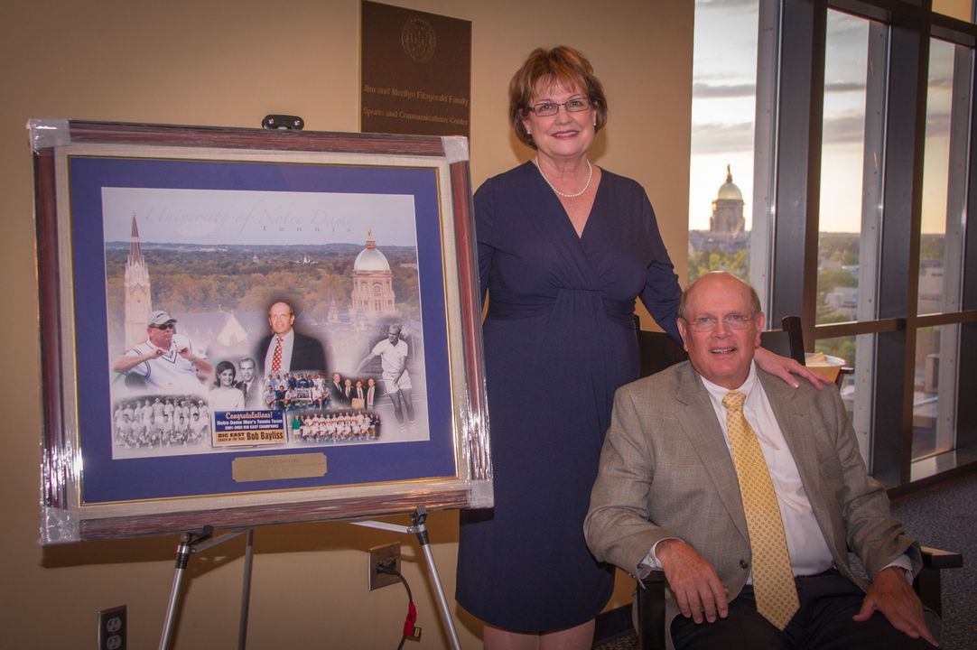 Bobby Bayliss (here with wife, Pat) was honored last Friday with a retirement party in the football press box.