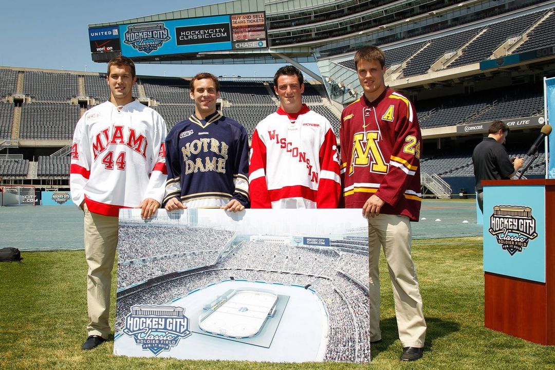 Irish defenseman Sam Calabrese with players from Miami and Wisconsin at Soldier Field.