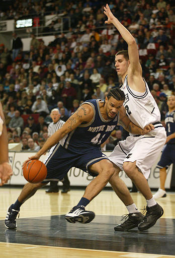 Irish Outlast Friars, 62-61 Dennis Latimore drives to the basket against the defense of Providence's Randall Hanke during the first half.