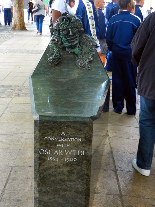 This statue honoring famous playwright Oscar Wilde sits on Adelaide Street just off Trafalgar Square in London. Built in 1998, the top side of the statue (not visible) includes an inscription from his play <i>Lady Windermere's Fan</i> and reads