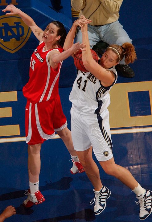 St. John's center Kati Kurtosi and center Courtney LaVere battle for a rebound during first half.