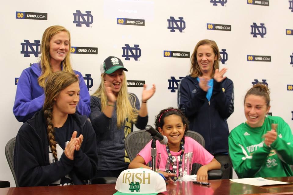 On her signing day, members of the women's soccer team surrounded Maria Bennett.