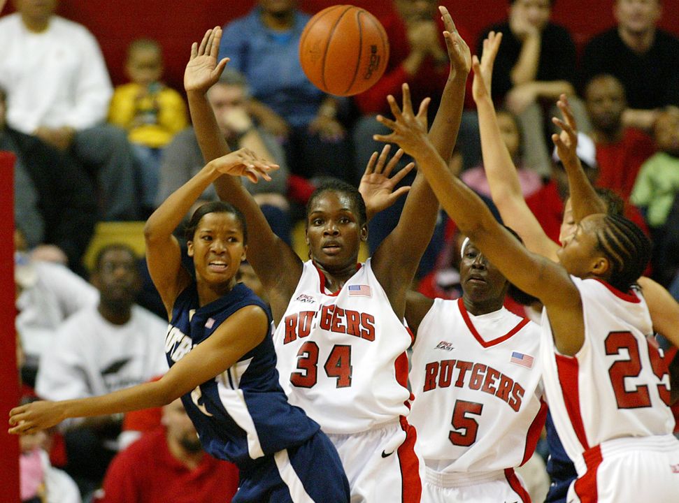 Charel Allen gets pressure from Rutgers' Michelle Campbell (34), Essence Carson (5) and Cappie Pondexter (25) during the first half. (AP Photo/Tim Larsen)