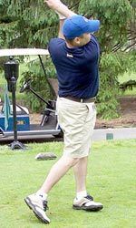 One of the 160 golfers swings away during the Monogram Club Golf Outing on June 2nd.