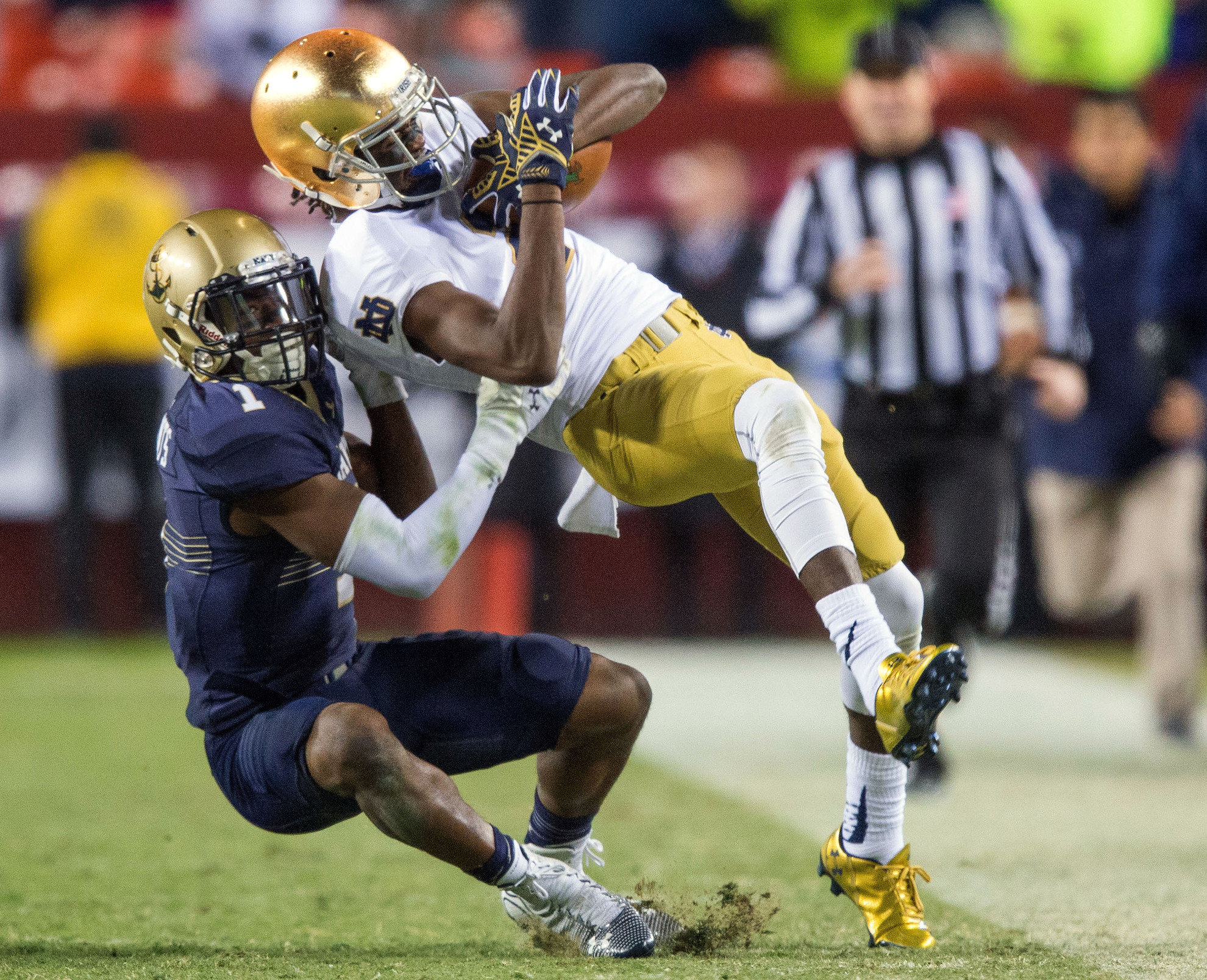 Notre Dame-Navy Football 2015: A Game of Mutual Respect Chris Brown makes a catch in front of Navy cornerback Brendon Clements in last year's 49-39 Irish victory.