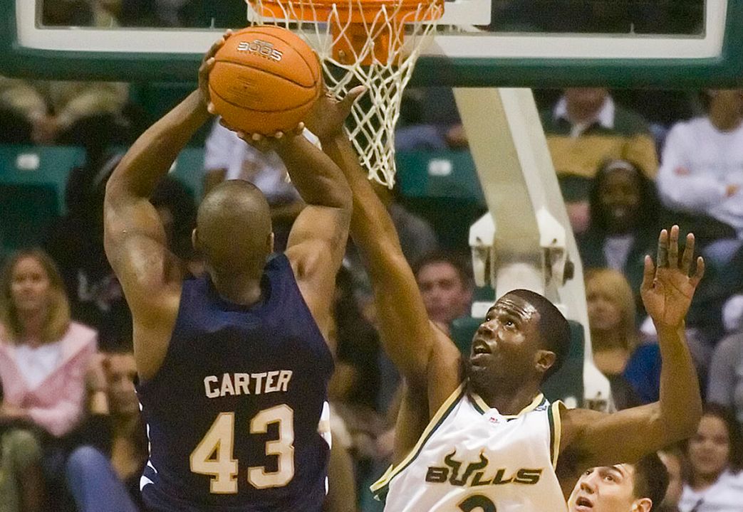 Russell Carter puts up a jump shot over South Florida's Melvin Buckley. (AP Photo/Steve Nesius)