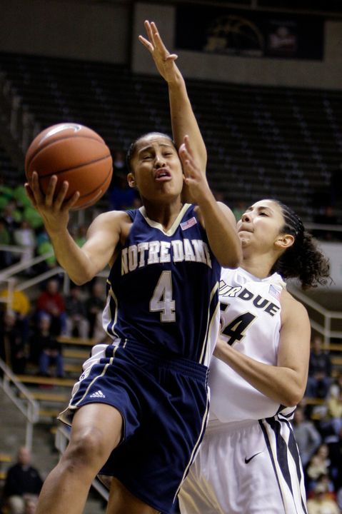 Notre Dame's Skylar Diggins, left, shoots in front of Purdue's Samantha Woods in the first half of an NCAA college basketball game in West Lafayette, Ind., Monday, Jan. 4, 2010. (AP Photo/Michael Conroy)