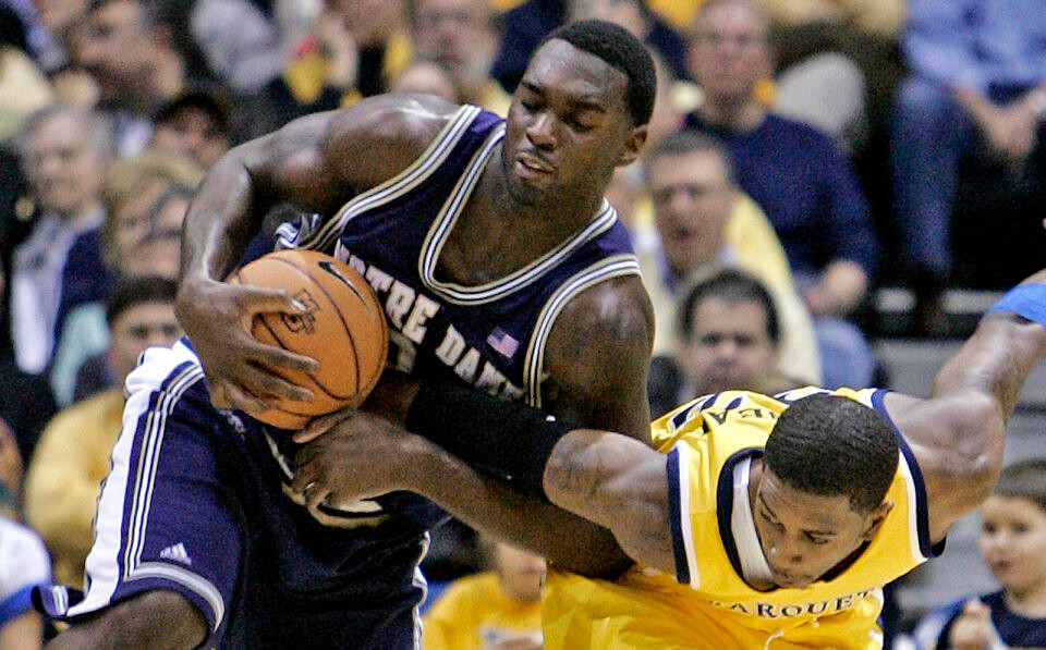 Irish Fall to Marquette on Last Second Shot, 67-65 Marquette's Jerel McNeal fouls Torin Francis as they go after a loose ball during the first half. (AP Photo/Morry Gash)