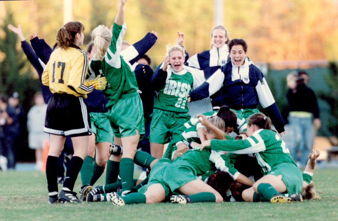 Cindy Dawn is mobbed by teammates after scoring the game-winning goal (1-0) in the national championship game against Portland in the three-overtime thriller.