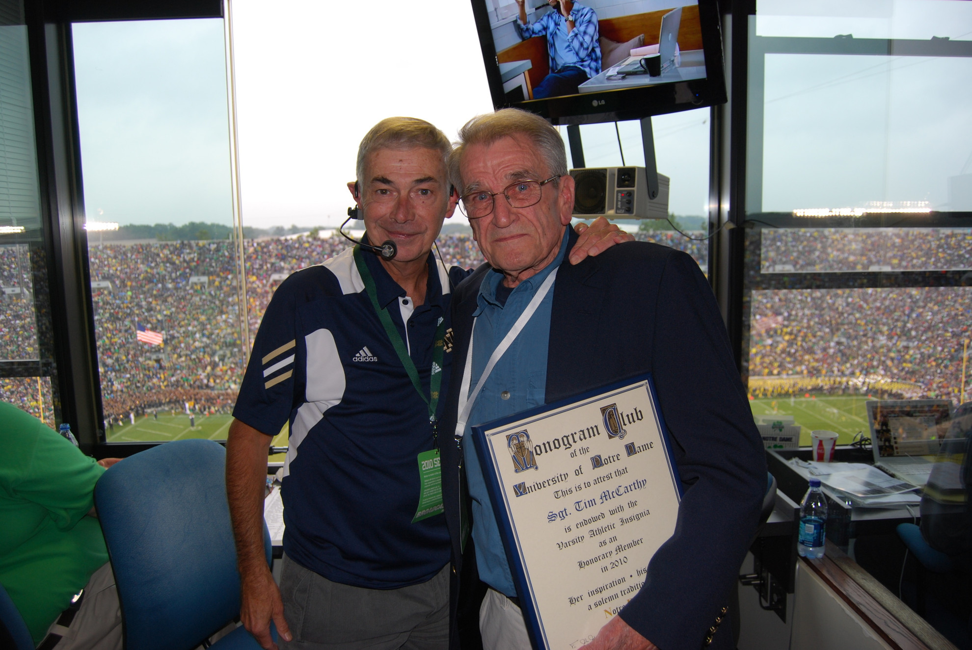May I Have Your Attention Please: Sgt. Tim McCarthy Awarded Honorary Monogram Public address announcer Mike Collins celebrated with McCarthy after he received his Monogram