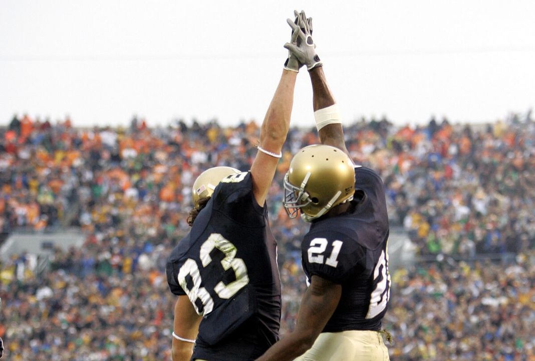 Notre Dame's Maurice Stovall, right, celebrates with teammate Jeff Samaardzija after Stovall scored on a 35-yard pass from Brady Quinn against Tennessee in the first quarter. (AP Photo/Michael Conroy)