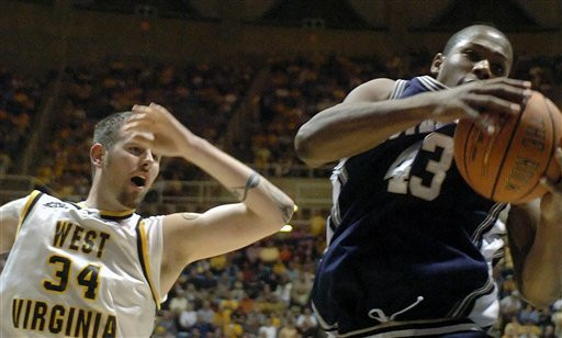 Irish Edged By Mountaineers, 71-70 Russell Carter collects a rebound during second half.