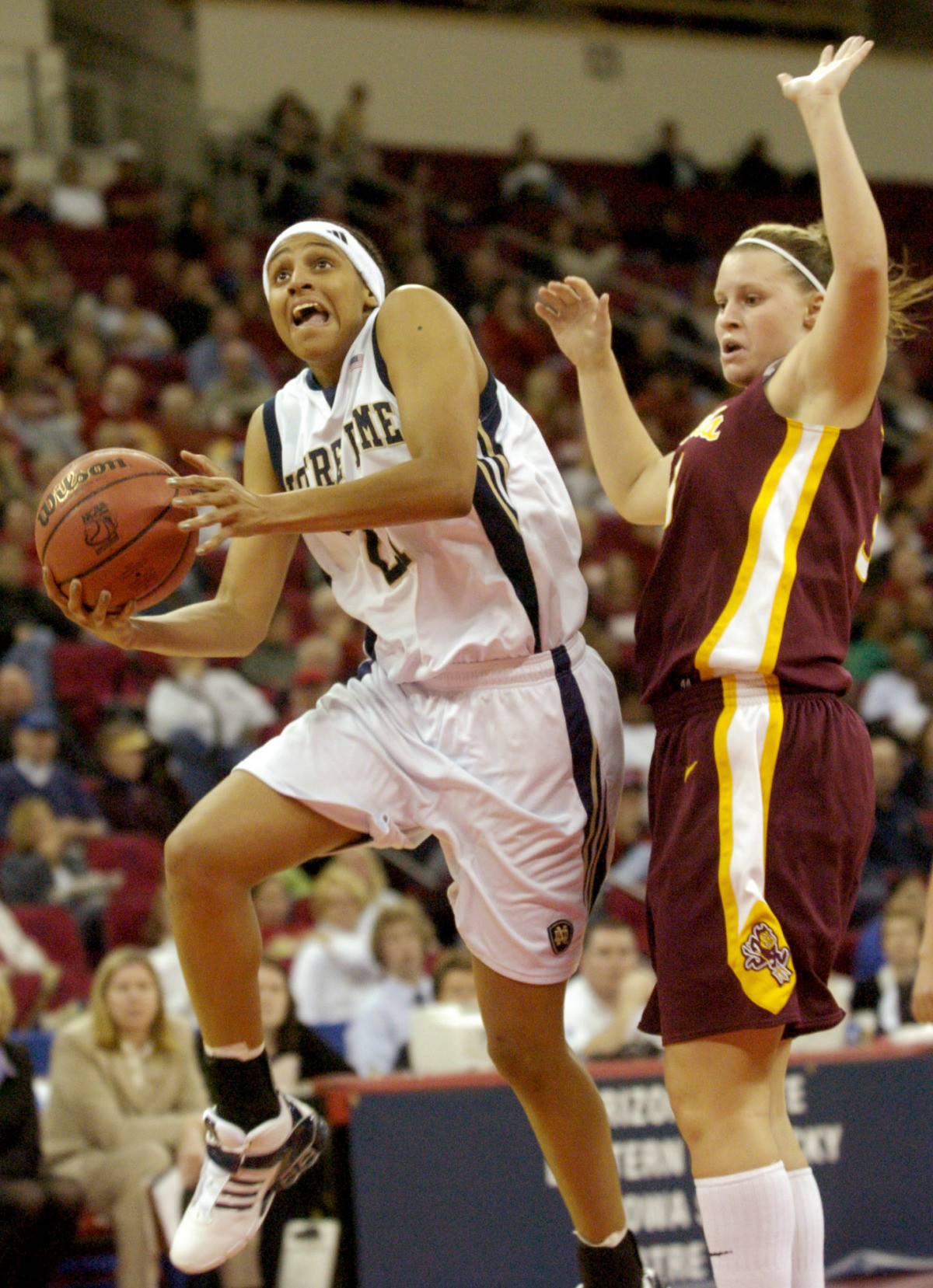 Irish Fall To Sun Devils In Second Round, 70-61 Jacqueline Batteast drives to the basket in front of Arizona State forward Amy Denson.