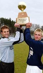 Chris Sawyer and Justin Detter hoist the 2003 BIG EAST Championship trophy.