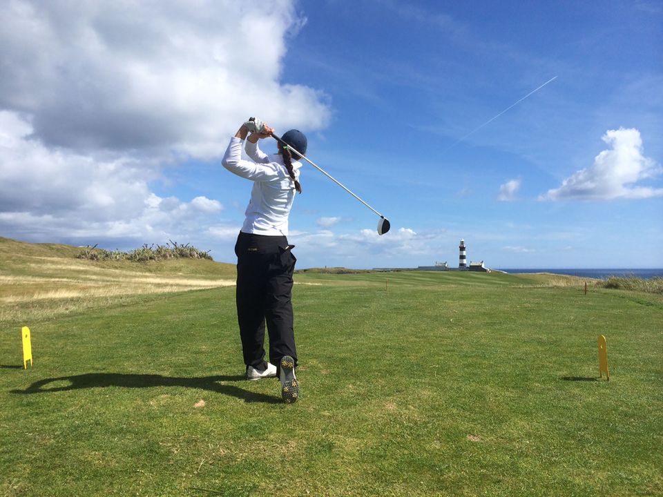 With the famous lighthouse at Old Head in the distance, Notre Dame senior captain Ashley Armstrong teed off Wednesday afternoon at the Old Head Golf Links in Kinsale County, Ireland.