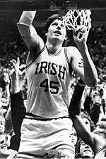 100 Years Remembered In 100 Days – Final Update Dave Batton cuts down the nets the old-fashioned way, held up by the student body in the Joyce Center.