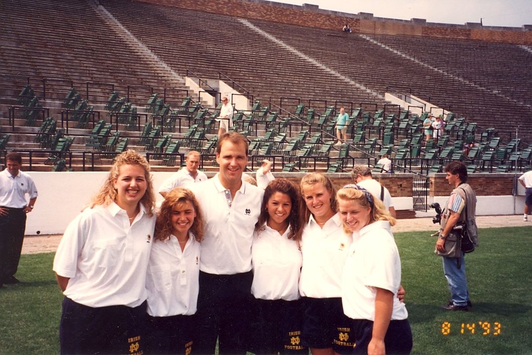 Christina Glorioso (second from left) with fellow Notre Dame junior managers Kristen Lechner (far left) and Kimberley Orga (far right) as well as former Irish assistant coach Skip Holtz.