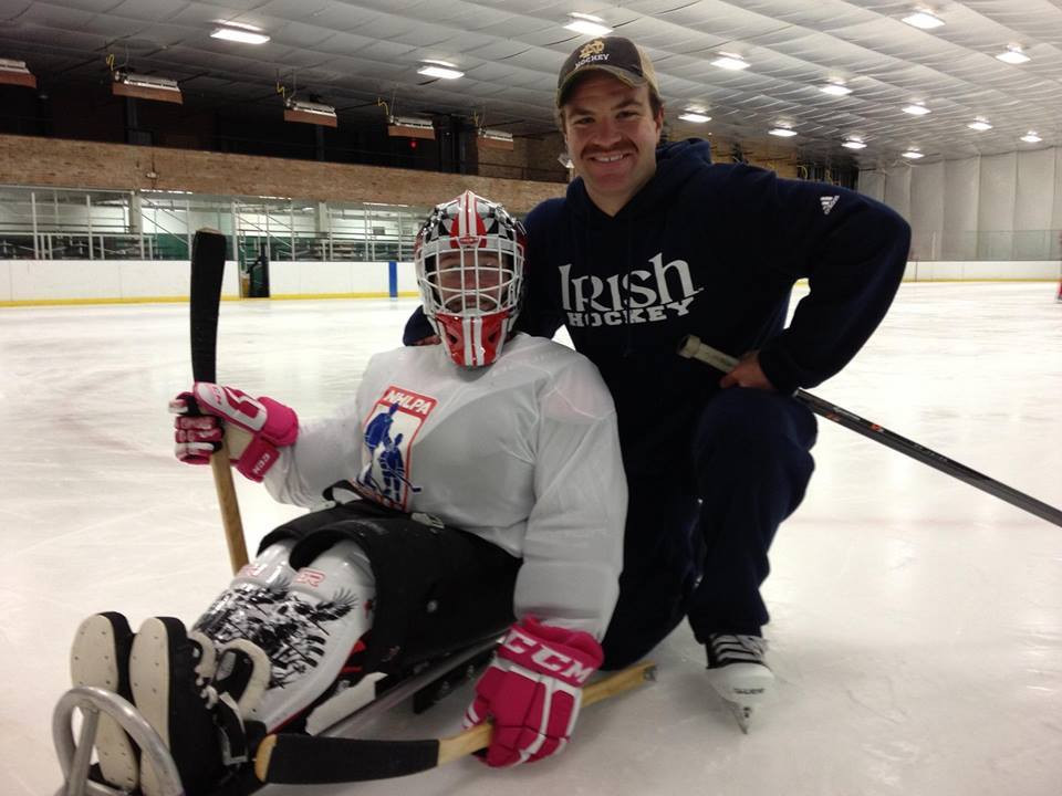 Irish Senior Joe Rogers Named Nominee For Hockey Humanitarian Award Joe Rogers poses with Sarah Lewis of the River City Sled Rovers, a local sled hockey team that he works with in his spare time.