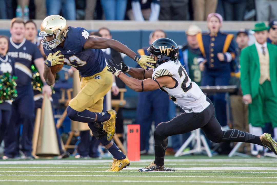 Josh Adams established a Notre Dame record with a 98-yard touchdown run in the second quarter of a 28-7 win over Wake Forest