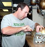 Henry Scroope has served as the football team's equipment manager since 2000.  His job is to maintain all the equipment used by the Notre Dame football team and to make sure that every player is protected when he takes the field.