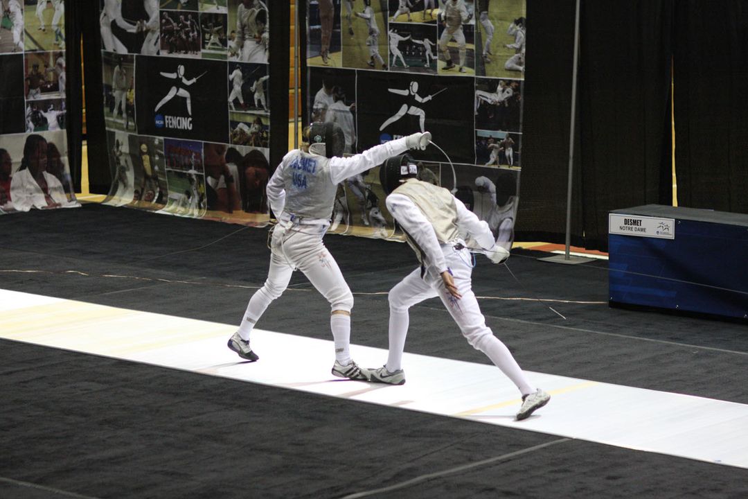 Ariel DeSmet scores a touch against Penn State's Miles Chamley-Watson in the championship foil bout that DeSmet won 15-13.