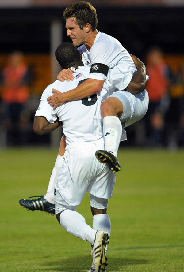 Irish Open Stadium In Fine Fashion With 5-0 Win Over Michigan Seniors Michael Thomas (top) and Bright Dike (bottom) celebrate one of Dike's three goals on the night.