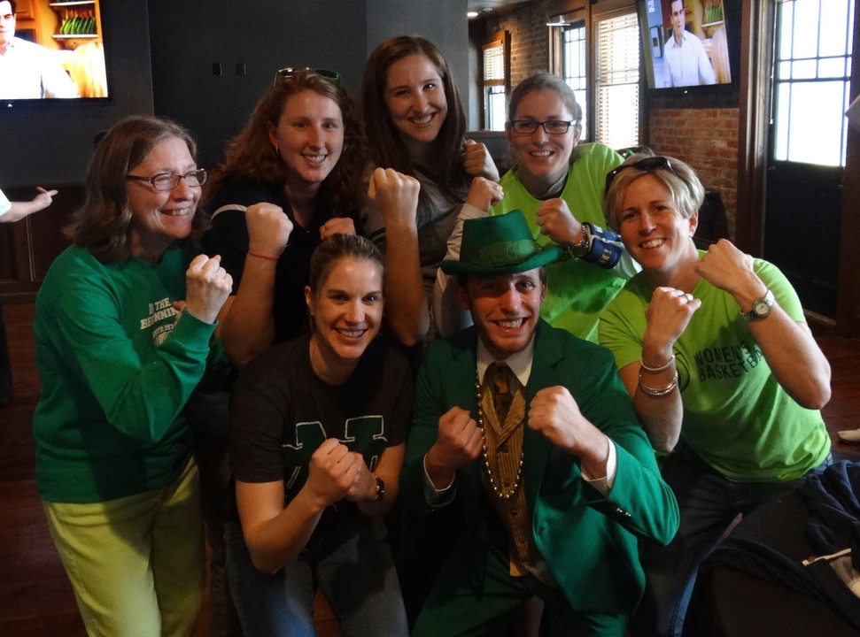 Women's basketball Monogram winners enjoying the pre-game reception with the Notre Dame leprechaun.