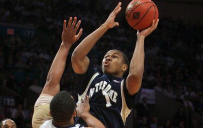 Tyrone Nash shoots over Penn State's Jamelle Cornley during the first half.