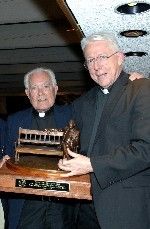 Father Theodore Hesburgh presented the Monogram Club's Moose Krause Distinguished Service Award to Father Monk Malloy in 2005.