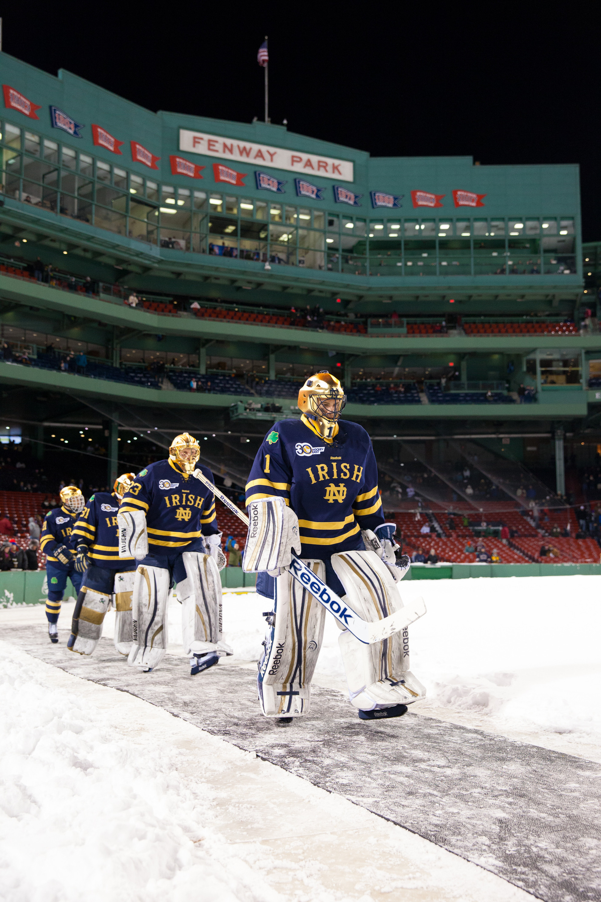 Irish Fall To Boston College, 4-3, In Frozen Fenway Steven Summerhays leads the Irish to the ice at Fenway Park on Jan. 4. Catch