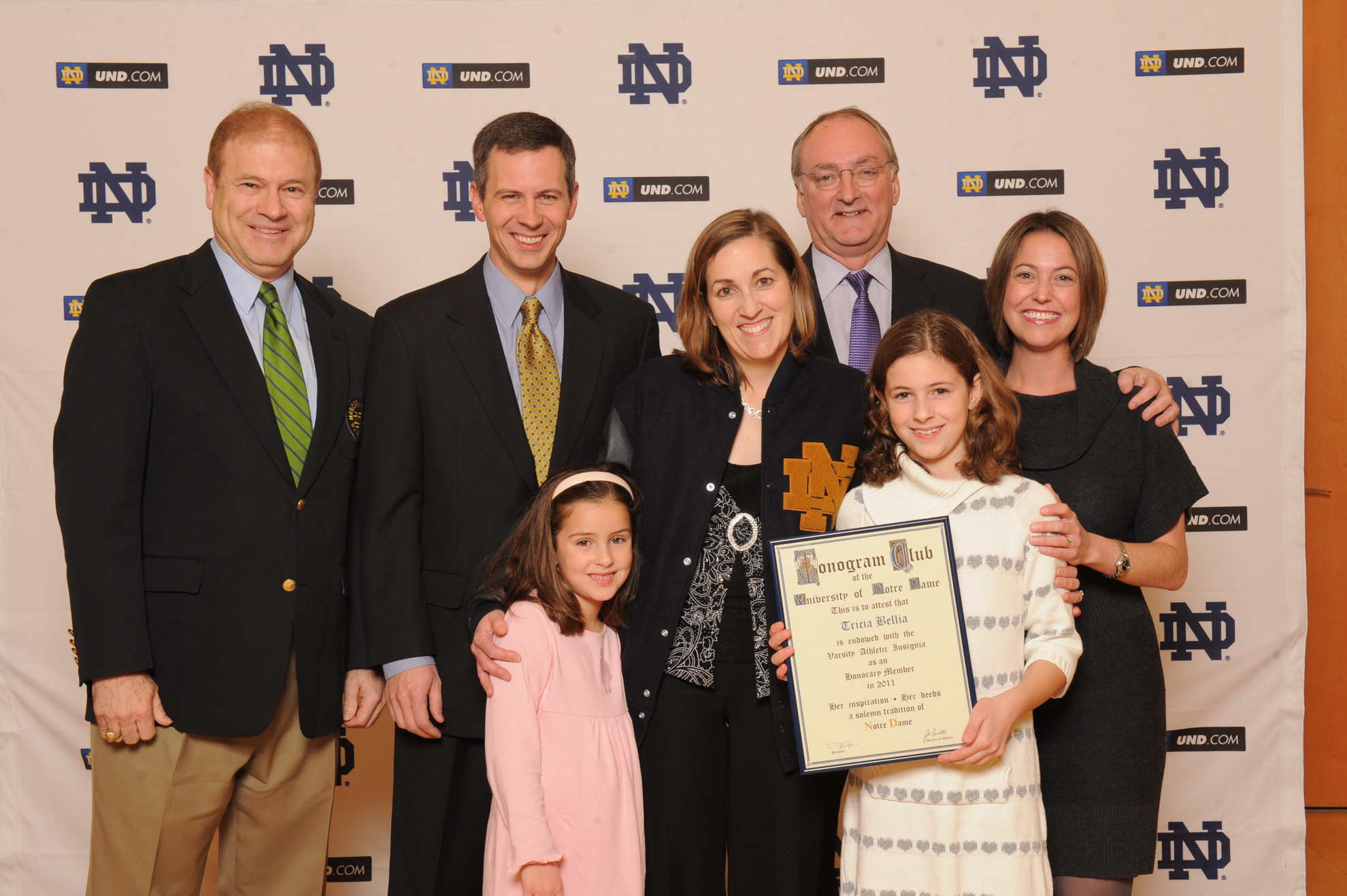 Faculty Athletics Representative Tricia Bellia Awarded Honorary Monogram Tricia Bellia (center) with her husband, A.J. (left), daughters, Kate and Molly, and Notre Dame athletics director Jack Swarbrick (photo by Mike Bennett)