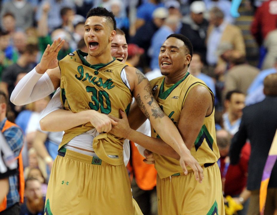Zach Auguste celebrates after the final buzzer goes off.
