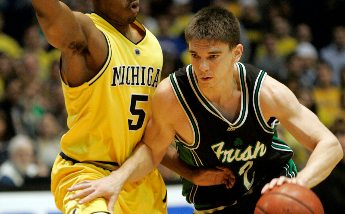 Irish Fall In 2OT Thriller Michigan guard Dion Harris (5) defends against Notre Dame guard Chris Quinn (2) during the first half of a second-round NIT basketball game Monday, March 20, 2006, in Ann Arbor, Mich. (AP Photo/Tony Ding)