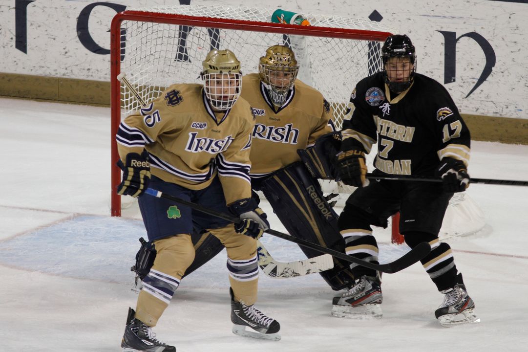 Notre Dame defenseman (#25) Kevin Lind and goaltender Steven Summerhays stop a Western Michigan scoring bid.  The Irish limited the Broncos to 14 shots in a 4-0 win.