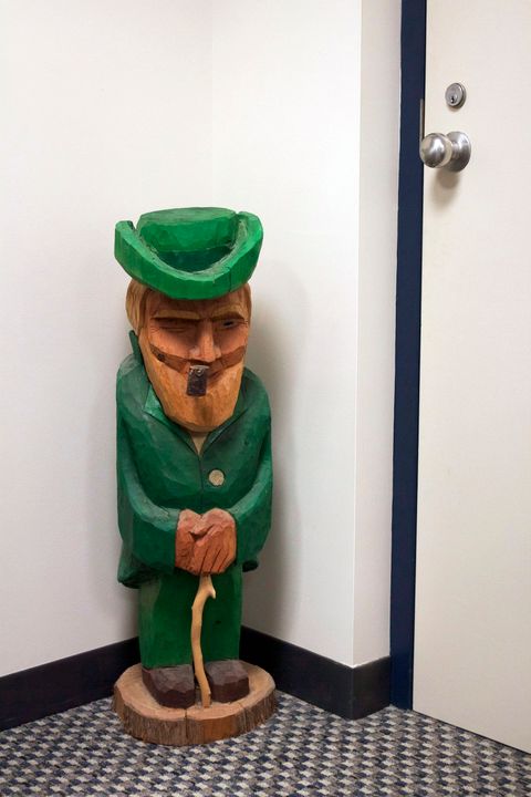Standing inconspicuously in a corner of Joe Piane's office, this wooden leprechaun statue is one of the more intriguing artifacts in the office of the longtime Fighting Irish track &amp; field/men's cross country coach.