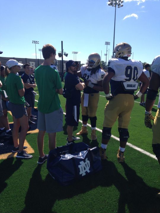 Sheldon Day helps keep things light at practice, here teasing assistant equipment manager Adam Myers.