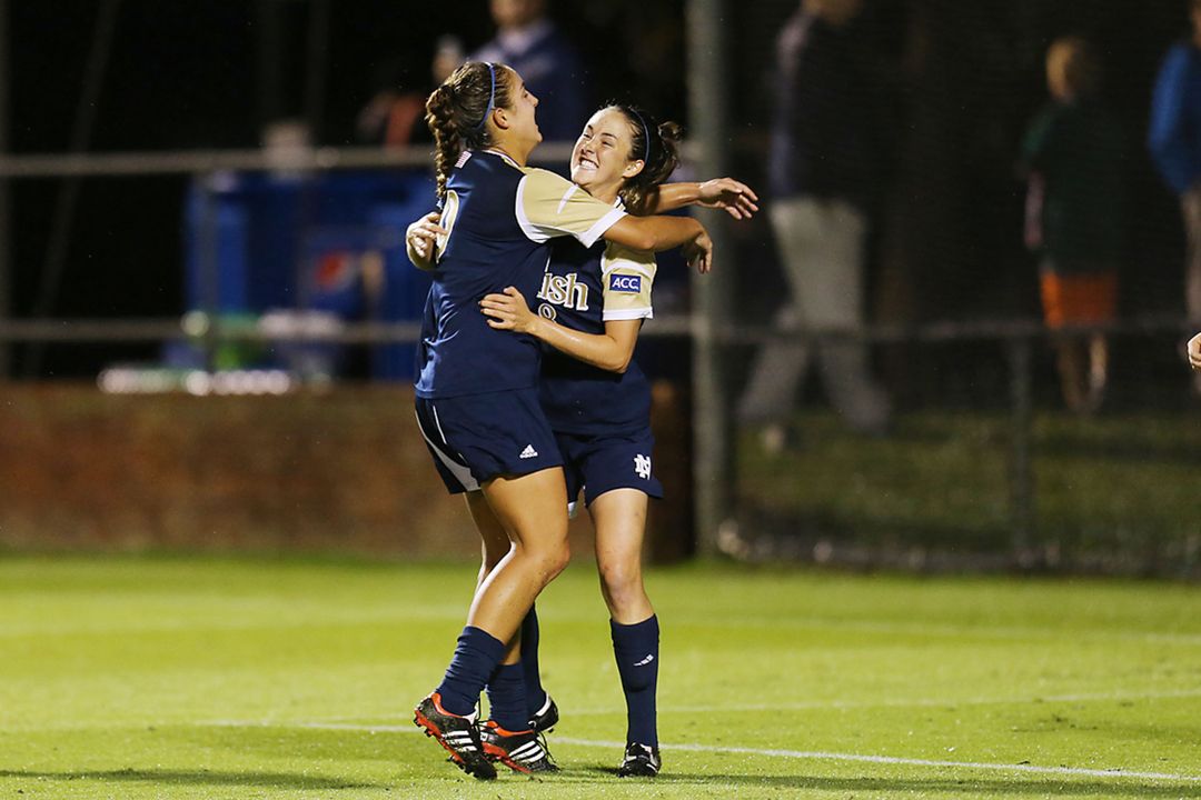 Senior midfielder/tri-captain Elizabeth Tucker (right) celebrates with junior forward Lauren Bohaboy (left) after the first of Tucker's two goals in Thursday's 3-2 double-overtime loss at #1 Virginia.
