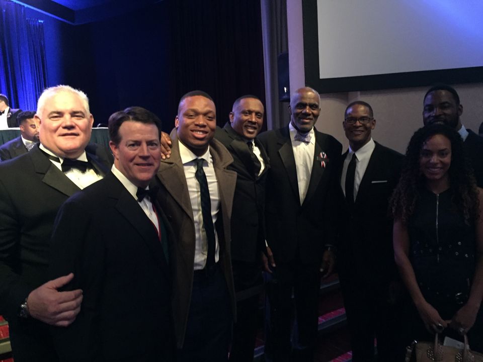 At the Heisman Dinner Gala Monday in New York--(left to right) Mike Brennan, Monogram Club president Kevin O'Connor, Romeo Okwara, Tim Brown, Justice Alan Page, Byron Spruell and Justin and Lauran Tuck