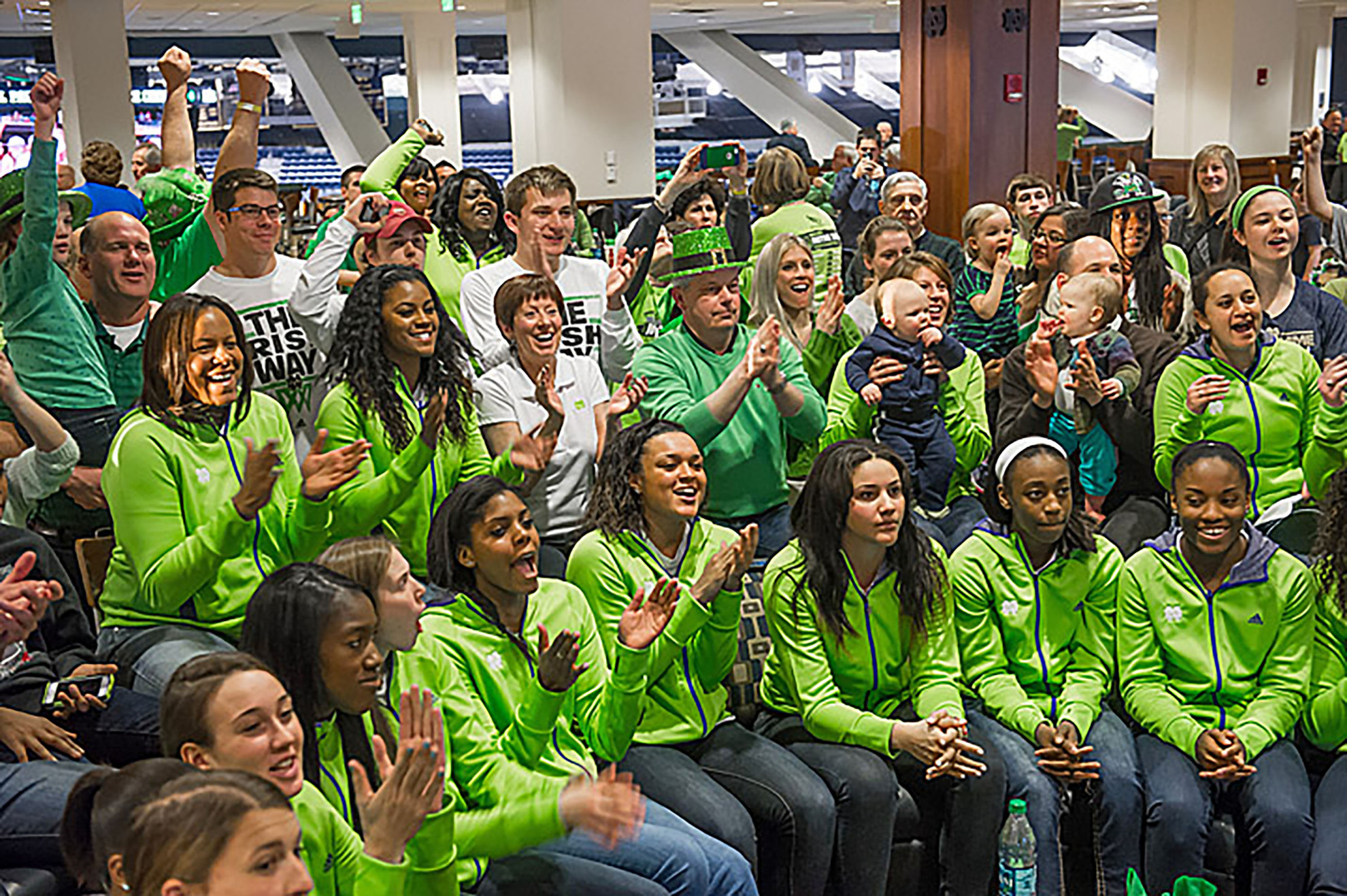 Notre Dame Earns 19th Consecutive NCAA Women’s Basketball Championship Berth Notre Dame head coach Muffet McGraw (center, white shirt) and the Fighting Irish celebrate their selection as a No. 1 seed in the 2014 NCAA Championship. Notre Dame will open tournament play at 1:30 p.m. (ET) Saturday against Robert Morris in Toledo, Ohio.