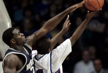 Torin Francis goes for a rebound with DePaul's Jabari Currie in the first half.