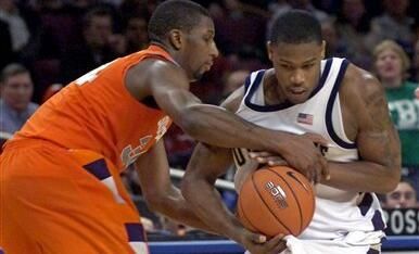 Russell Carter is fouled as Syracuse's Demetris Nichols attempts to steal the ball during second half.