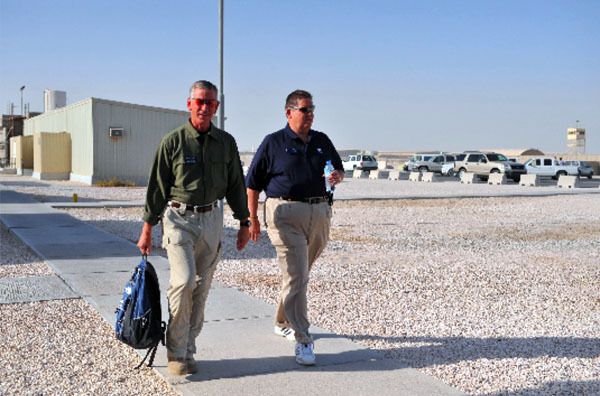 Charlie Weis (right) and Auburn coach Tommy Tuberville are two of five college football head coaches visiting U.S. Troops in the Middle East this week.