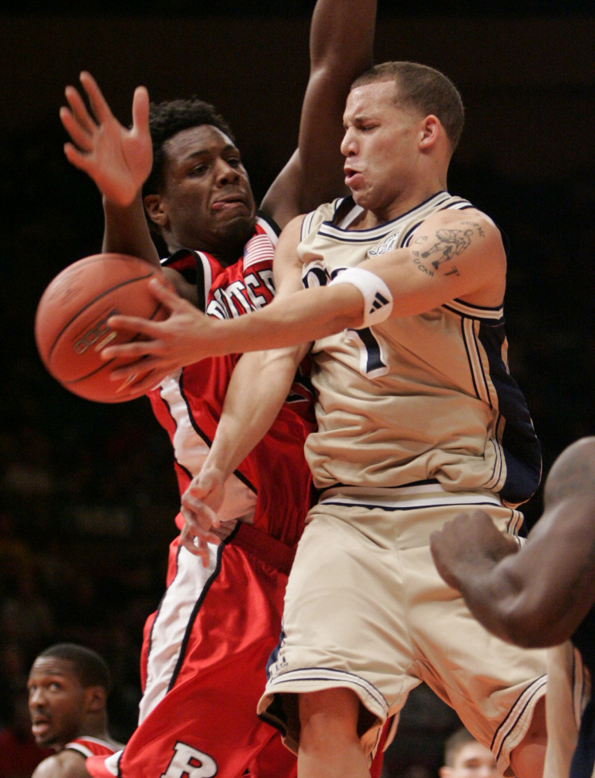 Notre Dame Falls To Rutgers In Big East Opening Round, 72-65 Chris Thomas passes the ball off against Rutgers' Ollie Bailey during the first half.