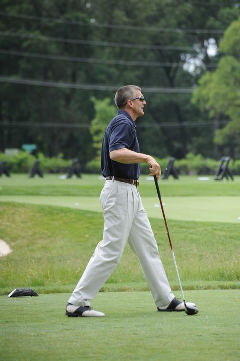 Monogram Club president Joe Restic prepares to tee off at the 2010 Riehle Open.
