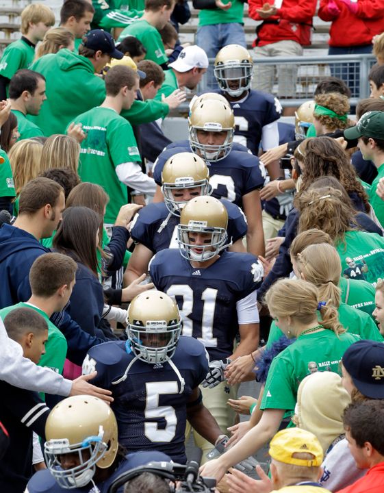 Notre Dame players enter Notre Dame Stadium through the student section prior to pre-game warmups before a game earlier this season.