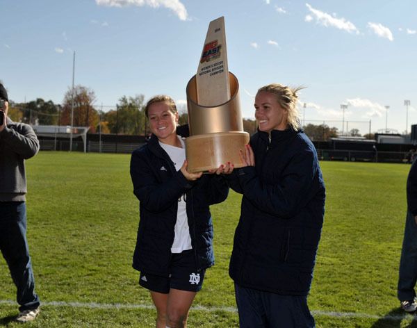 Senior co-captains Brittany Bock and Carrie Dew hold up the 2008 BIG EAST National Division championship trophy, which was presented to the Irish following Sunday's 6-0 win over Seton Hall on Senior Day at Alumni Field.