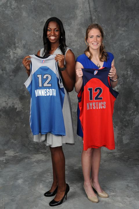 Notre Dame fifth-year senior forward/tri-captain Devereaux Peters (left) and senior guard/tri-captain Natalie Novosel (right) hold up the jerseys of the Minnesota Lynx and Washington Mystics, respectively, after both players were selected among the top eight picks in the 2012 WNBA Draft on Monday afternoon at the ESPN Studios in Bristol, Conn.